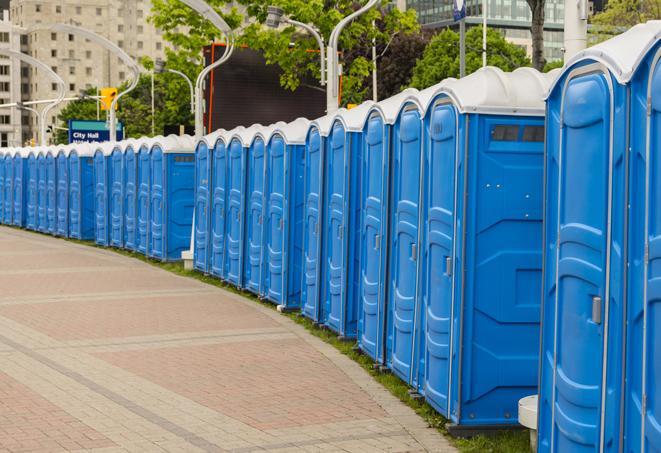 a row of portable restrooms set up for a special event, providing guests with a comfortable and sanitary option in Bellwood